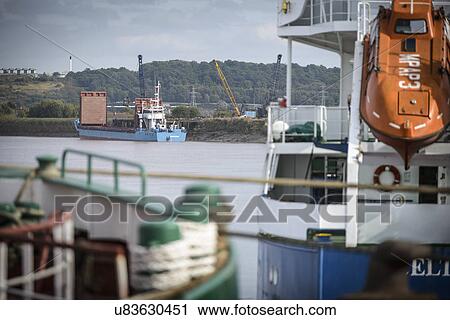 Small bulk load ship on river, view from port View Large Photo Image Stock Image - Small bulk load ship on river, view from port. Fotosearch
