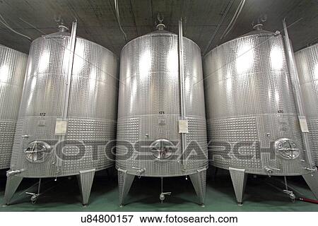 Stainless steel vats on industrial wine cellar View Large Photo Image Stock Photo - Stainless steel vats on industrial wine cellar. Fotosearch