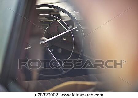 Stock Image - Steering wheel of vintage car. Fotosearch