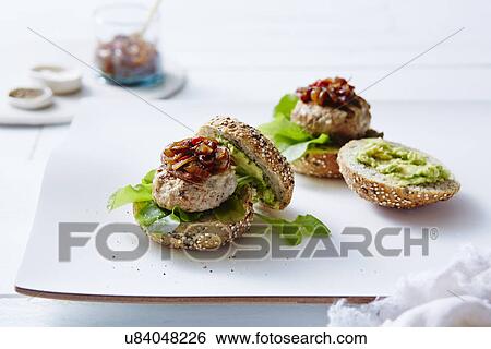 Still life of chicken and avocado burgers View Large Photo Image Stock Photograph - Still life of chicken and avocado burgers. Fotosearch