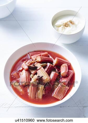 Stock Image - Still life of rhubarb compote with yogurt. Fotosearch