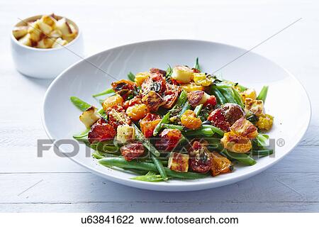 Still life of roast tomato and green bean salad View Large Photo Image Stock Image - Still life of roast tomato and green bean salad. Fotosearch