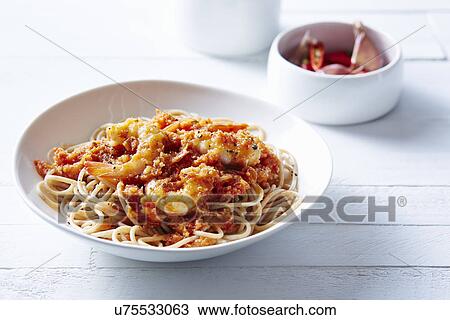 Stock Image - Still life of spaghetti with asian prawns. Fotosearch