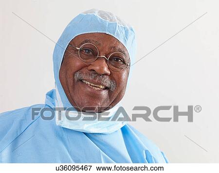 Stock Photo - Surgeon wearing surgical scrubs and protective mask. Fotosearch