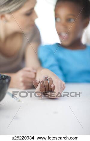 Teacher and girl holding hands View Large Photo Image Picture - Teacher and girl holding hands. Fotosearch