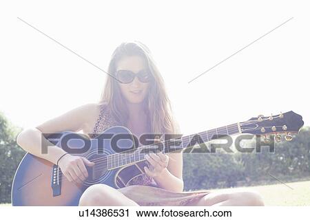 Teenager playing guitar View Large Photo Image Stock Image - Teenager playing guitar. Fotosearch
