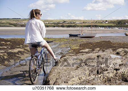 Teenager riding bike View Large Photo Image Stock Photo - Teenager riding bike. Fotosearch
