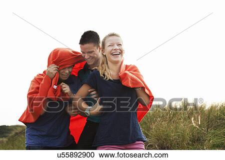 Teenagers wrapped in blanket View Large Photo Image Stock Image - Teenagers wrapped in blanket. Fotosearch