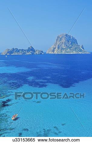 The rocky islet of Es Vedra, Formentera, Balearic Islands, Spain View Large Photo Image Stock Photography - The rocky islet of Es Vedra, Formentera, Balearic Islands, Spain. Fotosearch
