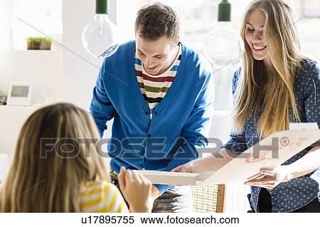 Stock Photography - Three friends with pizza. Fotosearch