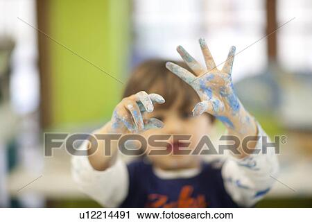 Toddler playing with watercolour in class View Large Photo Image Stock Image - Toddler playing with watercolour in class. Fotosearch