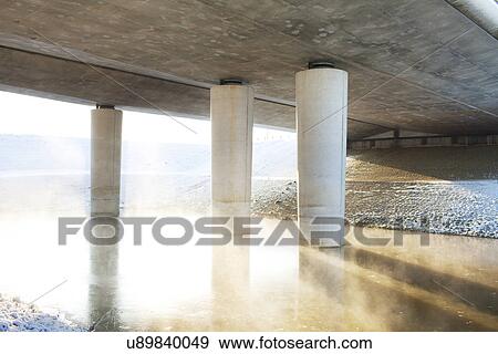 Transport bridge over misty river in winter View Large Photo Image Stock Photo - Transport bridge over misty river in winter. Fotosearch