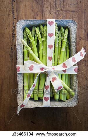 Picture - Tub of asparagus tied with ribbon. Fotosearch