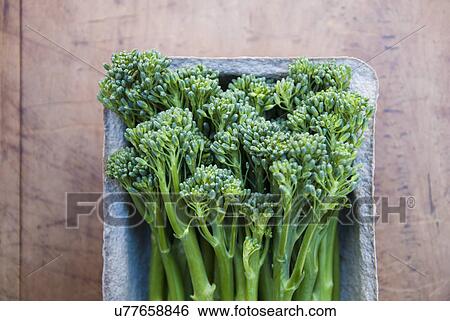 Stock Photograph - Tub of fresh broccoli. Fotosearch