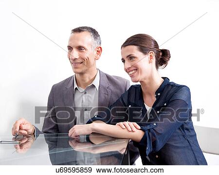 Stock Photo - Two businesspeople in meeting. Fotosearch