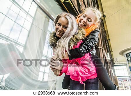 Two female friends fooling around View Large Photo Image Stock Photo - Two female friends fooling around. Fotosearch