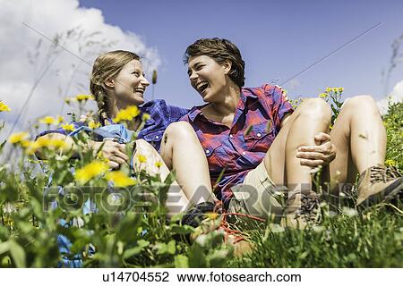 Two female friends in field View Large Photo Image Stock Image - Two female friends in field. Fotosearch