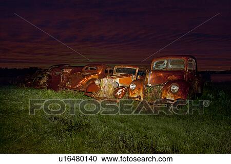 Vintage cars abandoned in scrap yard View Large Photo Image Stock Image - Vintage cars abandoned in scrap yard. Fotosearch
