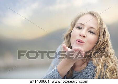 Woman blowing a kiss, Hout Bay, Cape Town, South Africa View Large Photo Image Stock Image - Woman blowing a kiss, Hout Bay, Cape Town, South Africa. Fotosearch