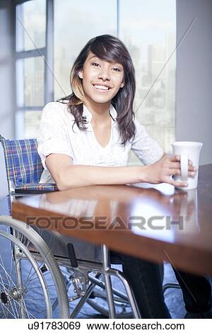 Stock Photo - Woman in wheelchair. Fotosearch