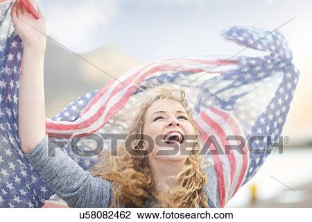 Woman waving with scarf of stars and stripes, Hout Bay, Cape Town, South Africa View Large Photo Image Stock Image - Woman waving with scarf of stars and stripes, Hout Bay, Cape Town, South Africa. Fotosearch