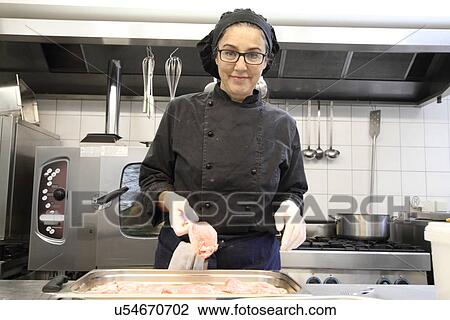Woman working in restaurant kitchen View Large Photo Image Stock Image - Woman working in restaurant kitchen. Fotosearch