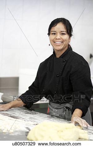 Woman working in restaurant kitchen View Large Photo Image Stock Photo - Woman working in restaurant kitchen. Fotosearch