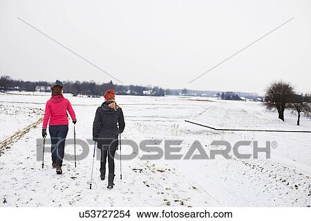 Picture - Women walking over ice. Fotosearch