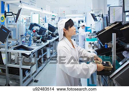 Worker at small parts manufacturing factory in China View Large Photo Image Picture - Worker at small parts manufacturing factory in China. Fotosearch