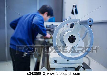 Worker at small parts manufacturing factory in China View Large Photo Image Stock Image - Worker at small parts manufacturing factory in China. Fotosearch