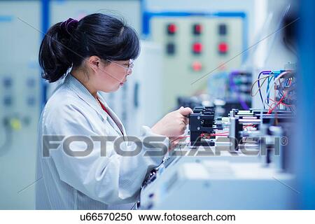 Worker at small parts manufacturing factory in China View Large Photo Image Stock Image - Worker at small parts manufacturing factory in China. Fotosearch