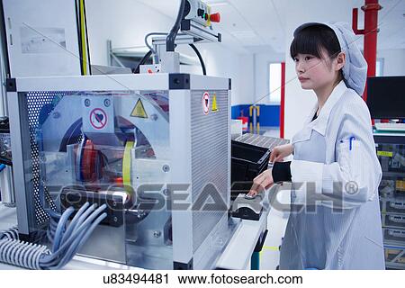 Worker at small parts manufacturing factory in China View Large Photo Image Stock Image - Worker at small parts manufacturing factory in China. Fotosearch