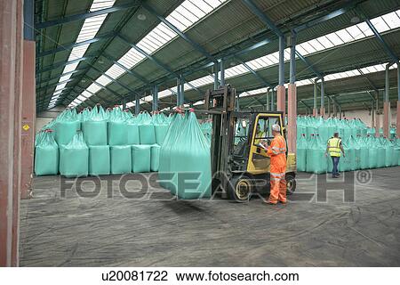 Workers and fork lift truck in bulk fertiliser store in port View Large Photo Image Stock Image - Workers and fork lift truck in bulk fertiliser store in port. Fotosearch