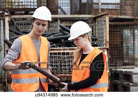 Workers at metal recycling plant View Large Photo Image Stock Photography - Workers at metal recycling plant. Fotosearch