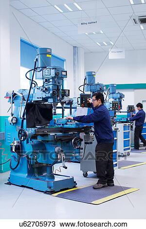 Workers at small parts manufacturing factory in China View Large Photo Image Stock Image - Workers at small parts manufacturing factory in China. Fotosearch