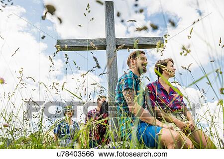 Young adults by cross View Large Photo Image Stock Photograph - Young adults by cross. Fotosearch