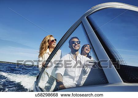 Young adults on boat, Gavle, Sweden View Large Photo Image Stock Photo - Young adults on boat, Gavle, Sweden. Fotosearch