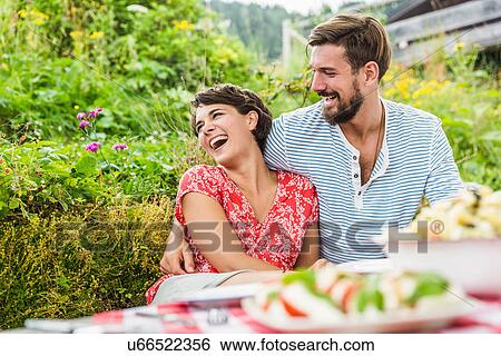 Young couple having picnic lunch, Tyrol, Austria View Large Photo Image Stock Photograph - Young couple having picnic lunch, Tyrol, Austria. Fotosearch