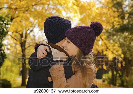 Stock Photo - Young couple hugging in autumn park, Vienna, Austria. Fotosearch