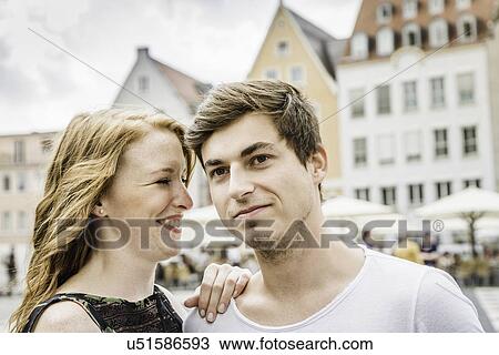 Young couple in town square in Augsburg, Bavaria, Germany View Large Photo Image Stock Image - Young couple in town square in Augsburg, Bavaria, Germany. Fotosearch