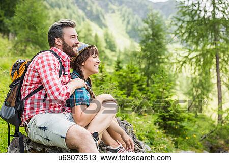 Young couple looking at view, Tyrol, Austria View Large Photo Image Stock Image - Young couple looking at view, Tyrol, Austria. Fotosearch