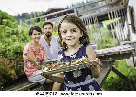 Young family preparing picnic lunch, Tyrol, Austria View Large Photo Image Stock Image - Young family preparing picnic lunch, Tyrol, Austria. Fotosearch