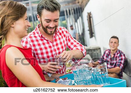 Young man flirting with waitress, Tyrol, Austria View Large Photo Image Stock Image - Young man flirting with waitress, Tyrol, Austria. Fotosearch