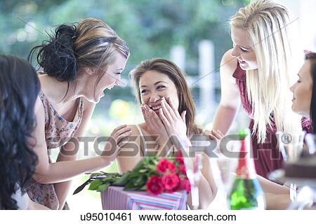 Young woman and friends with birthday presents View Large Photo Image Stock Image - Young woman and friends with birthday presents. Fotosearch