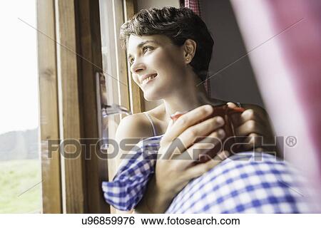 Young woman drinking coffee in holiday chalet, Tyrol, Austria View Large Photo Image Stock Photograph - Young woman drinking coffee in holiday chalet, Tyrol, Austria. Fotosearch