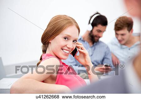 Young woman on cell phone View Large Photo Image Stock Photo - Young woman on cell phone. Fotosearch