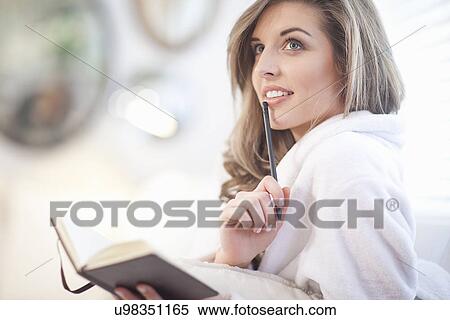 Young woman with diary and pen View Large Photo Image Stock Photography - Young woman with diary and pen. Fotosearch