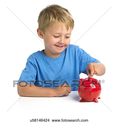 Picture - Boy putting money in a piggy bank. Fotosearch