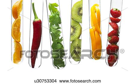 Picture - Fruit and vegetables in test tubes. Fotosearch