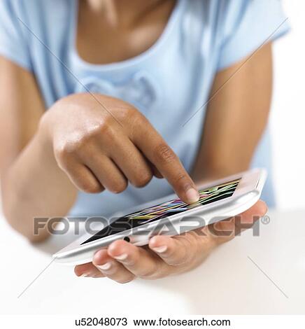 Stock Image - Girl using tablet computer. Fotosearch